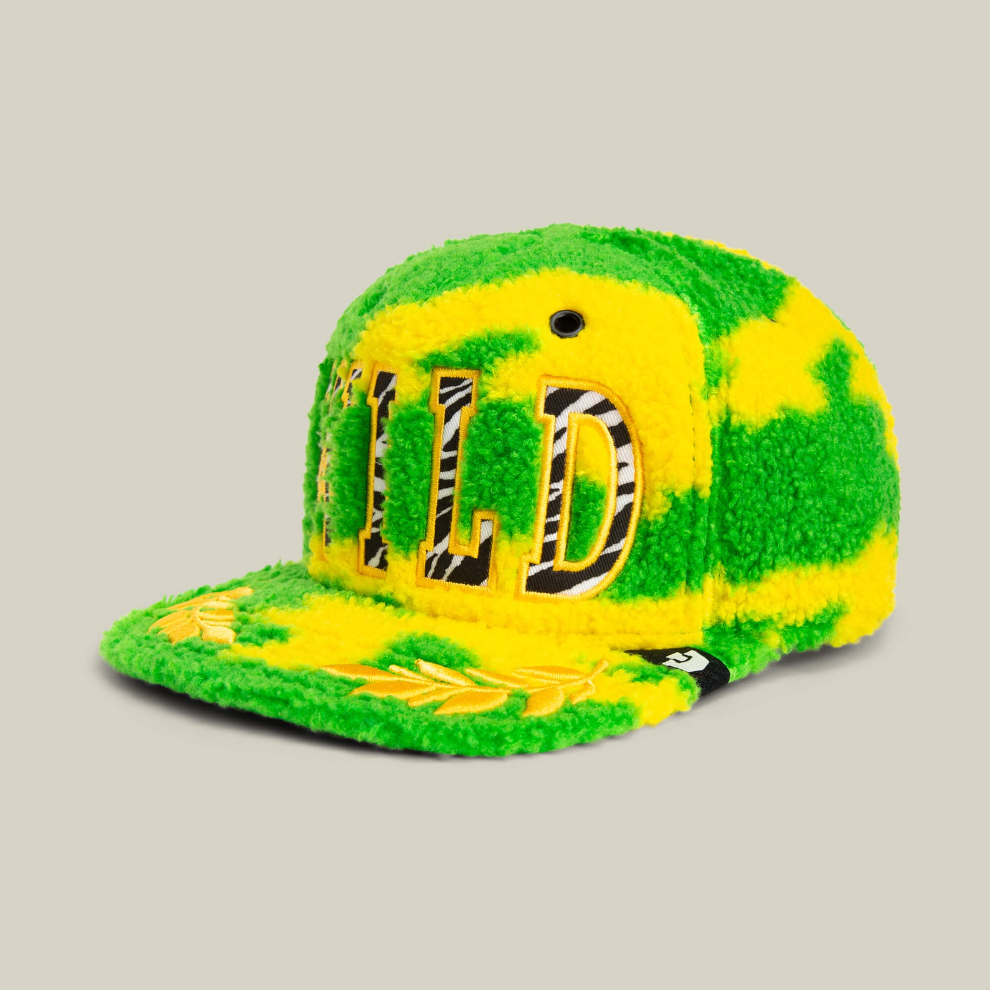 The Loose Cannon by Goorin Bros. is a fluffy neon green sherpa cap featuring "WILD" in jungle lettering on the front and a laurel design on the brim.