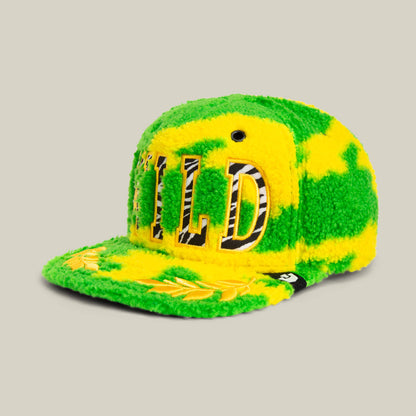 The Loose Cannon by Goorin Bros. is a fluffy neon green sherpa cap featuring "WILD" in jungle lettering on the front and a laurel design on the brim.