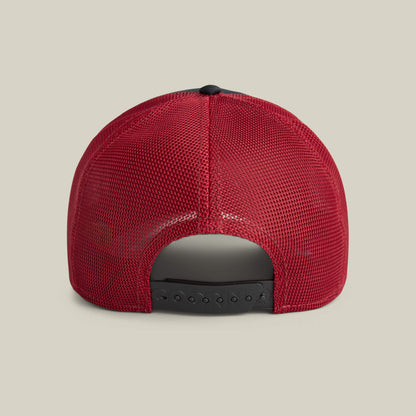 The Means No baseball cap by Goorin Bros. is shown from the back, featuring red mesh and an adjustable black snapback closure—a bold statement piece for any outfit.