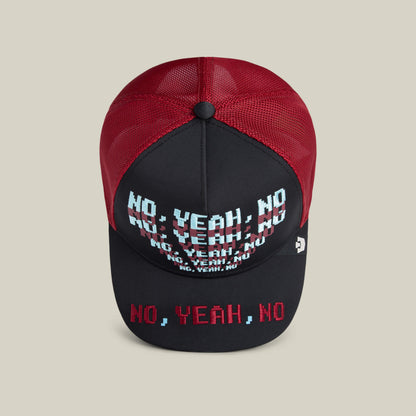 The Means No hat by Goorin Bros. features a black and red mesh design with "NO, YEAH, NO" printed multiple times in white, blue, and red on the front and brim—a bold conversation starter.