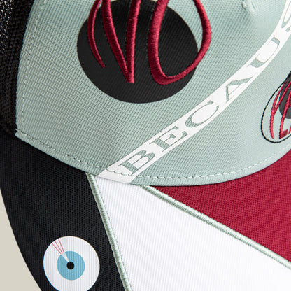 Close-up of the Goorin Bros. Means Agreed cap with geometric color blocks, embroidered "NO," "BECAUSE," and a blue eye—ideal to pair with your confident casual or agreement T-shirt.