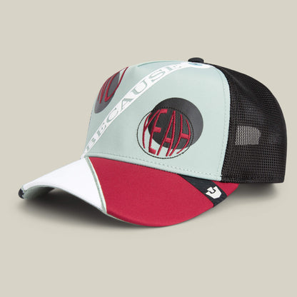 The "Means Agreed" trucker hat by Goorin Bros. features black mesh, mint green, red, and white panels with bold YEAH and BECAUSE text—perfect for pairing with your favorite confident casual shirt for a standout look.