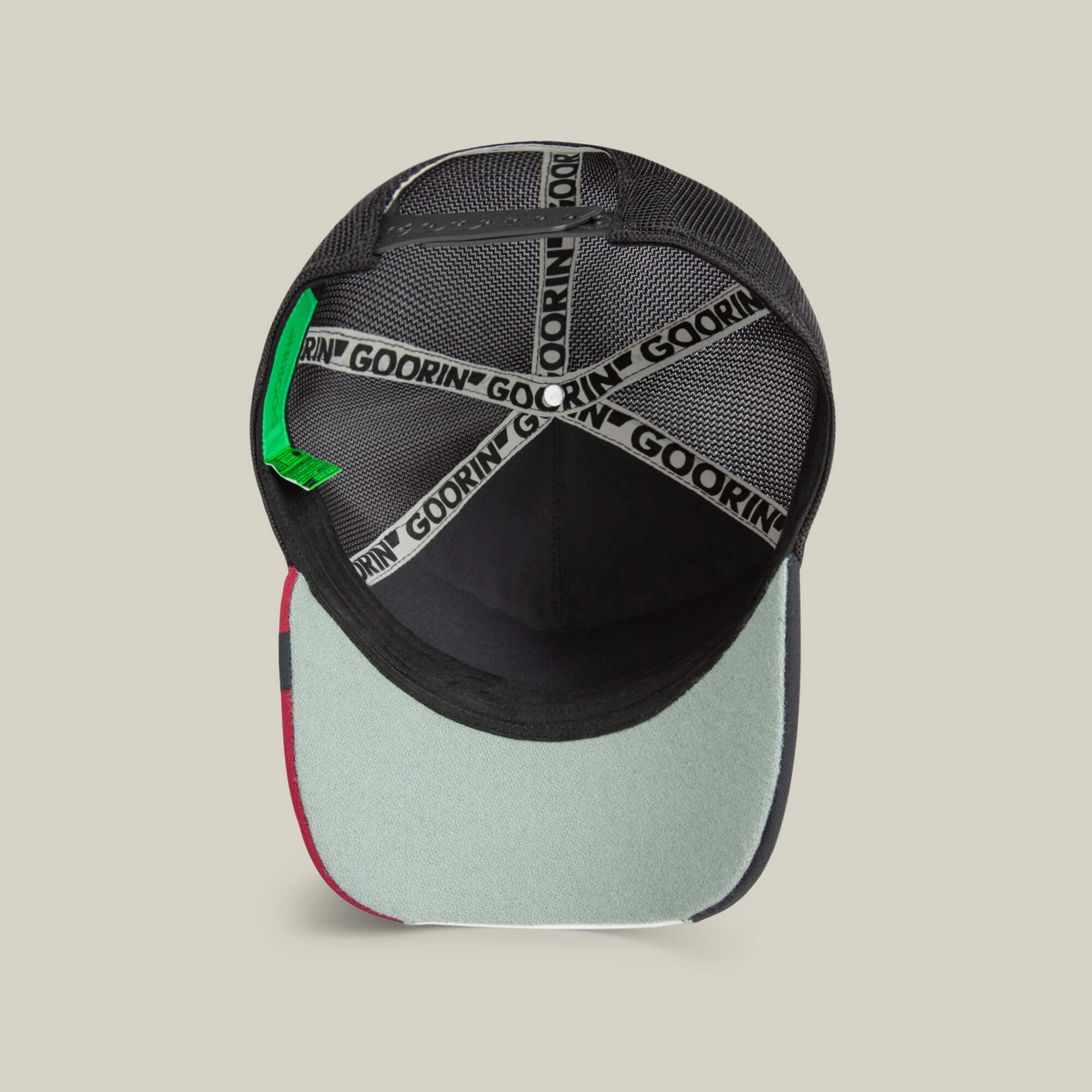 Inside view of the Goorin Bros. Means Agreed cap shows mesh lining, “GOORIN” taping, a green tag, and light blue brim underside—style it with a confident casual shirt for an effortlessly cool look.