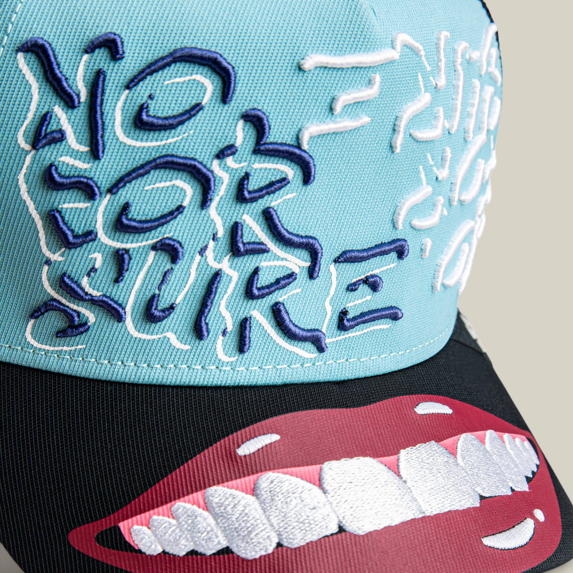 Show your confidence with Goorin's Means Understood hat, featuring blue and black colors, "NO FOR SURE" embroidery, and a red lips graphic with white teeth on the brim.