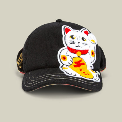 The F is for Fortune cap by Goorin Bros. in VOID features an embroidered white lucky-cat (maneki-neko) with yellow and red accents on the front, adding winter charm to your style.