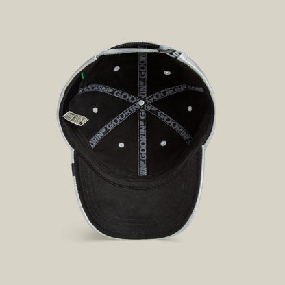 The Put a Panther On It classic fit black baseball cap by Goorin Bros. has white stitching, a small fabric tag on the left, and an inner seam tape with GOODLIFE print, evoking the sleek style typical of Goorin hats.