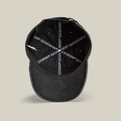 The Goorin Bros. "Put a Panther On It" hat in black is shown from above, highlighting its interior with black seams and “GOORIN” branding—an everyday classic fit.