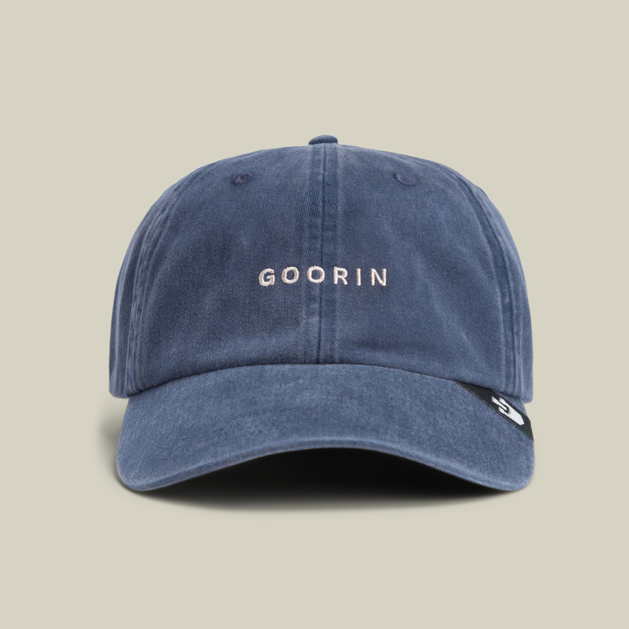 A classic blue cap, the Papa Cap Italiano by Goorin Bros. features "GOORIN" embroidered in white on the front and is shown against a plain beige background.