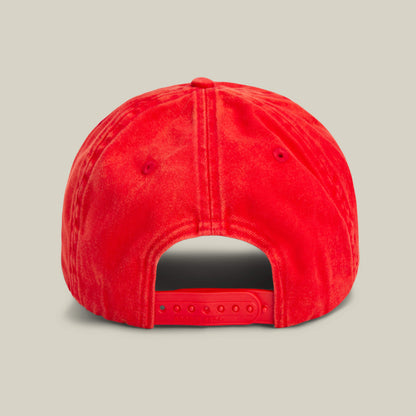 The Goorin Bros. Papa Cap Italiano is a classic red cap, seen from the back, and features an adjustable snap closure.