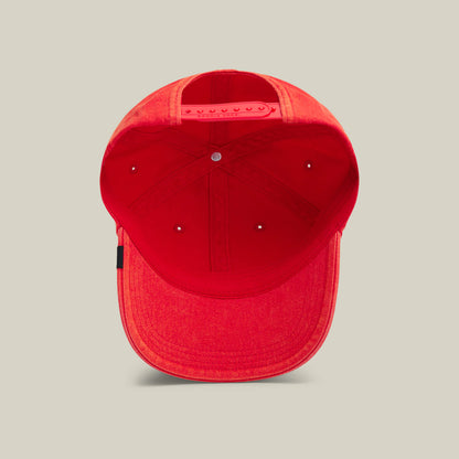 A red Goorin Bros. Papa Cap Italiano is shown from underneath, displaying the inner seams, sweatband, and adjustable snap closure at the back.