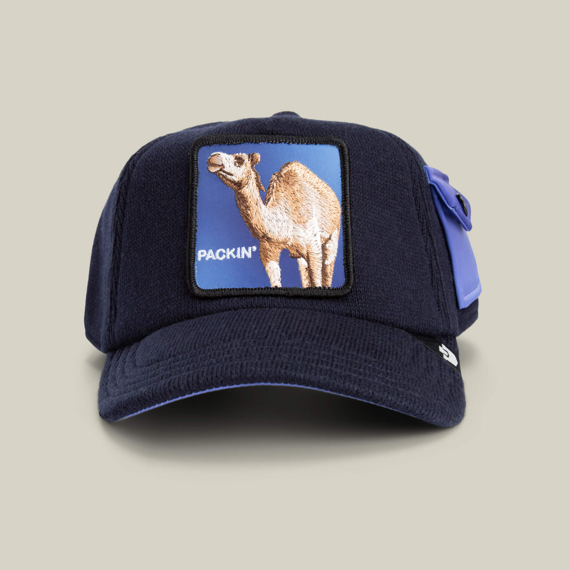 The Goorin Bros. Don't Say Fudge cap in GALACTIC features a camel PACKIN patch, a right-side pocket, and is crafted for supreme comfort—just like your coziest sweater.