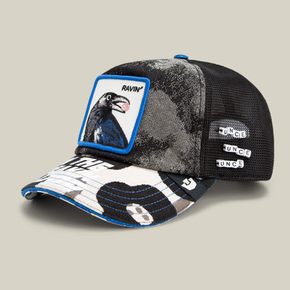 The Goorin Bros. Techno is a black and white mesh baseball cap with a crow patch, graphic bill, and TUNCE spelled in letter beads—an ideal rave hat or bold festival fashion accessory.