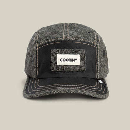 The Billed Demand by Goorin Bros. is a VOID-colored fabric field hat with a denim texture, white stitching, and a rectangular Goorin patch featuring the GOORIN logo on the front.