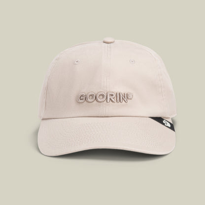 The Papa Core hat by Goorin Bros. features beige stitching, GOORIN embroidered on the front, and a small black tag on its curved brim, shown against a plain light background.