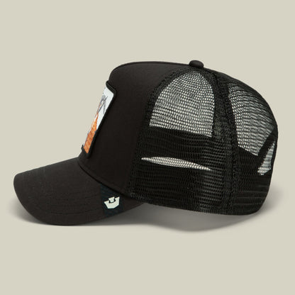 The Goorin Bros. Goat Trucker is a black mesh trucker hat with a solid black front panel, featuring a small patch detail on the side, shown in a studio product shot against a neutral background.