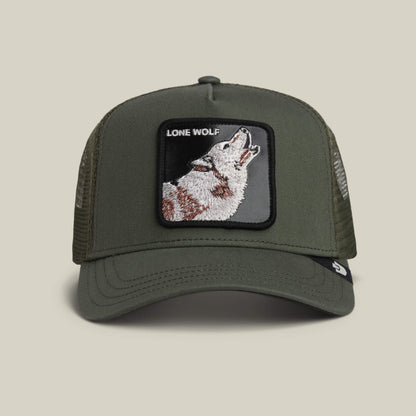 The Lone Wolf by Goorin Bros. is a PALM green trucker hat with a mesh back, featuring a howling wolf patch and "LONE WOLF" text on the front—ideal for those with true outlaw energy.
