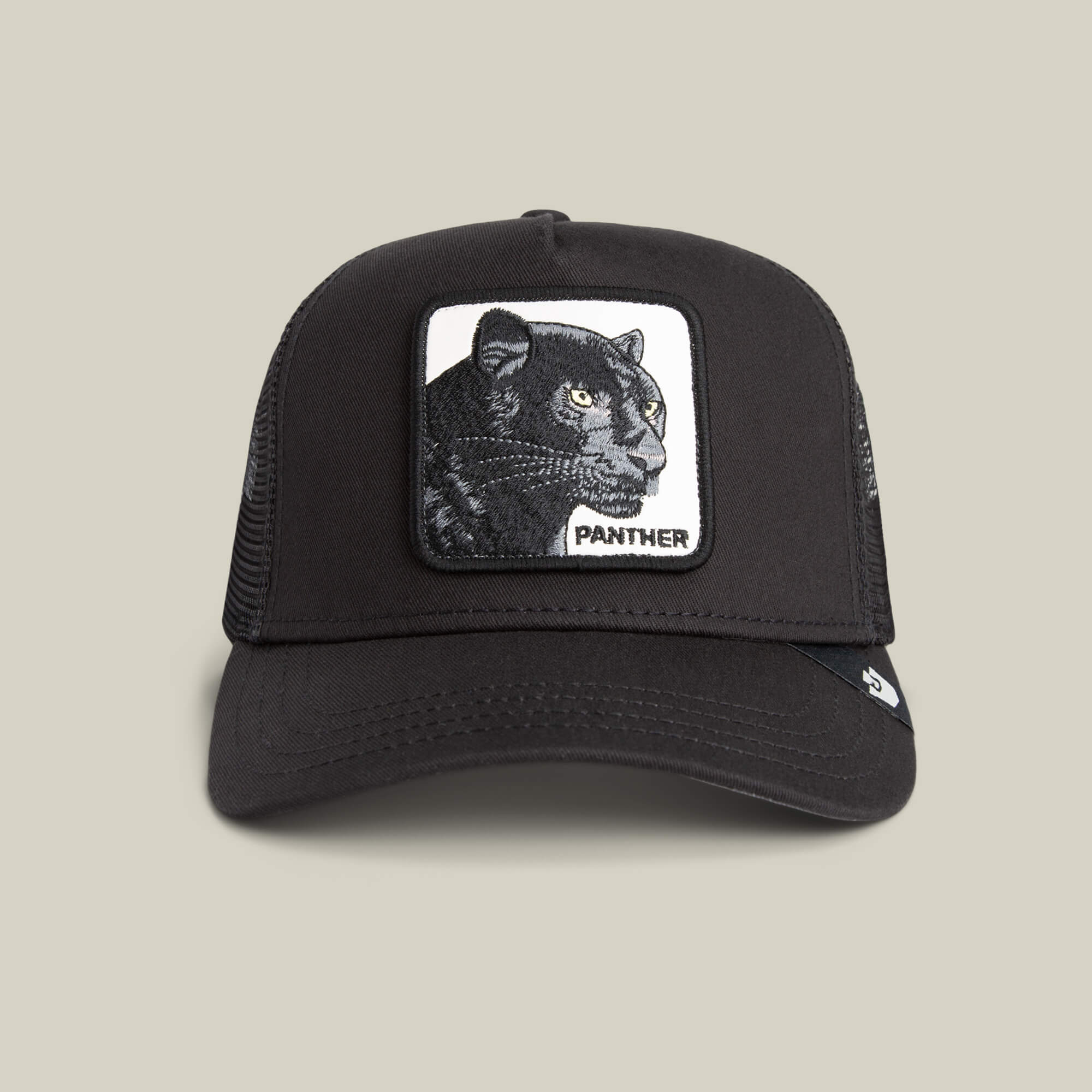 The Goorin Bros. Panther Trucker in VOID features a mesh back and an embroidered panther patch with "PANTHER" on the front—a standout hat for bold style.