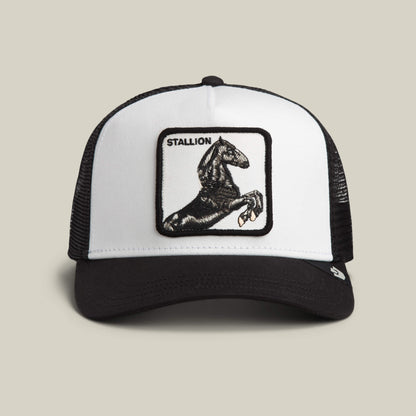 The Goorin Bros. Stallion Trucker in DUST/VOID features a front patch with a rearing black horse and the word STALLION above it.