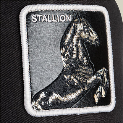 The Goorin Bros. Stallion Trucker is a black and white hat featuring an embroidered rearing horse with the word "STALLION" on a black fabric patch.