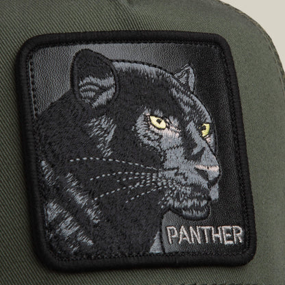 A close-up of The Panther patch by Goorin Bros.—a green fabric with an embroidered black panther, yellow eyes, and 'PANTHER' in white at the bottom right—perfect for bold style on your classic hat.