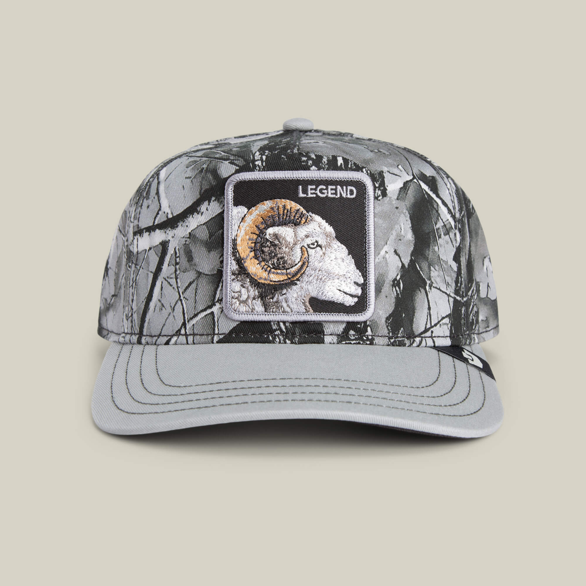 The Legend Camo by Goorin Bros. is a gray frosted camo Low Pro Fit baseball cap, featuring a front bighorn patch with an embroidered ram and "LEGEND" above it.