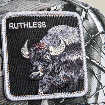 A close-up of a Goorin Bros. Ruthless Camo patch featuring an embroidered buffalo and the word “RUTHLESS” on a camo-patterned background.