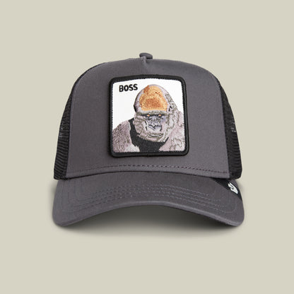 The Boss Trucker by Goorin Bros. is a gray mesh trucker hat featuring a bold gorilla patch with the word "BOSS"—a standout accessory for power moves and unique style.