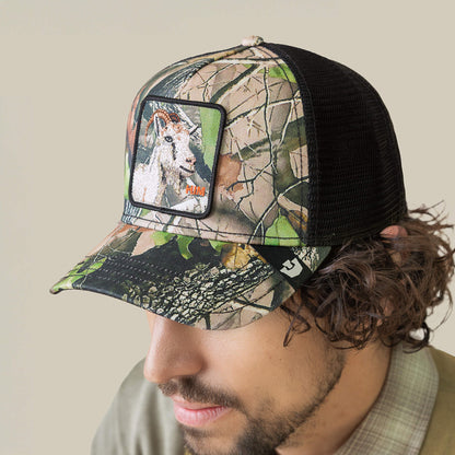 Wearing the Camouflage Goat by Goorin Bros., a forest-themed mesh trucker hat with a front patch that features an embroidered goat.
