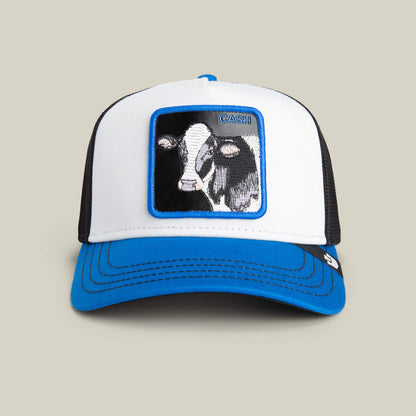 The Goorin Bros. Tricolor Cow trucker hat features a white and blue front, black mesh back, and a patch with a cow's face and "CASH" embroidered above—perfect for showing off your bold wallet style.