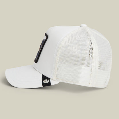 The Goorin Bros. Toxic Trucker hat is displayed from the side against a plain background, showcasing its white mesh design, curved brim, and a black patch on the front panel.
