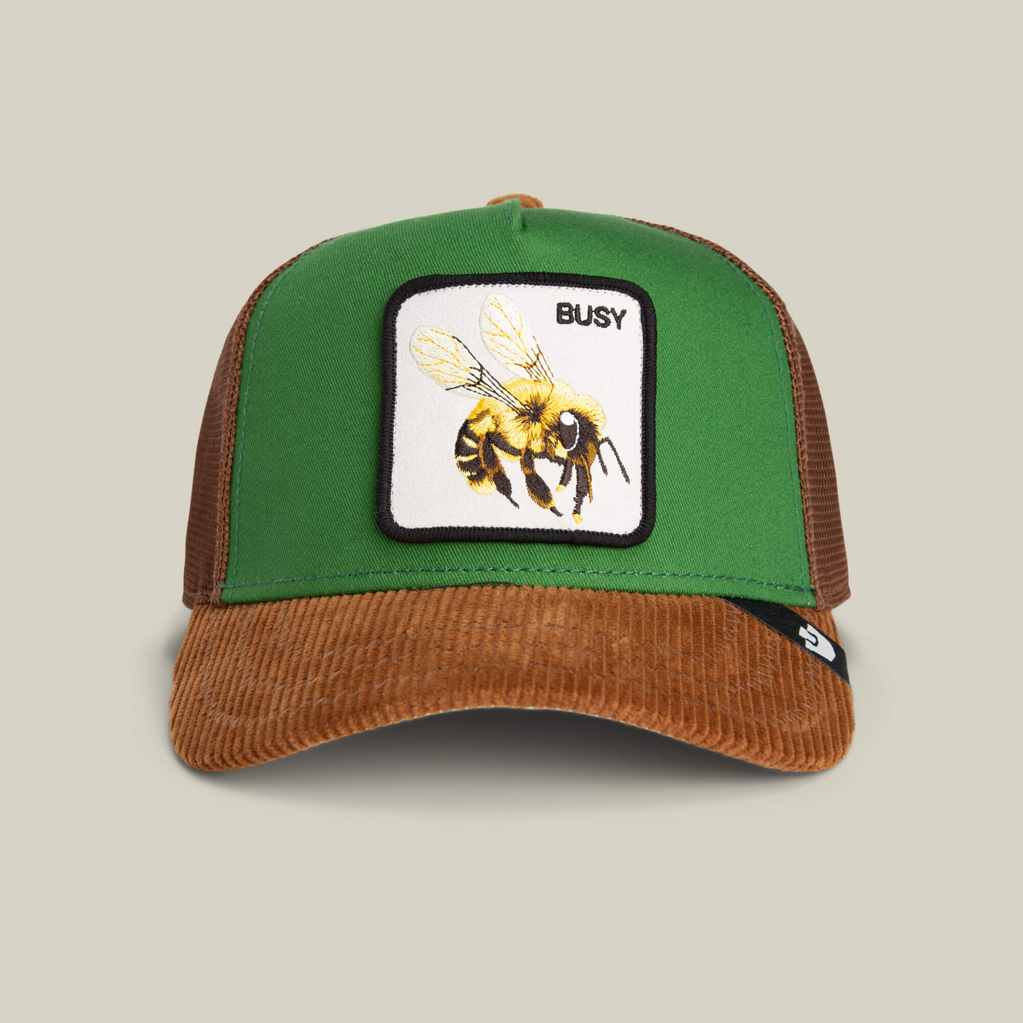 The Goorin Bros. Busy Remix hat features green and honey brown mesh with a bee patch and BUSY on the front—ideal for your next garden-party look.