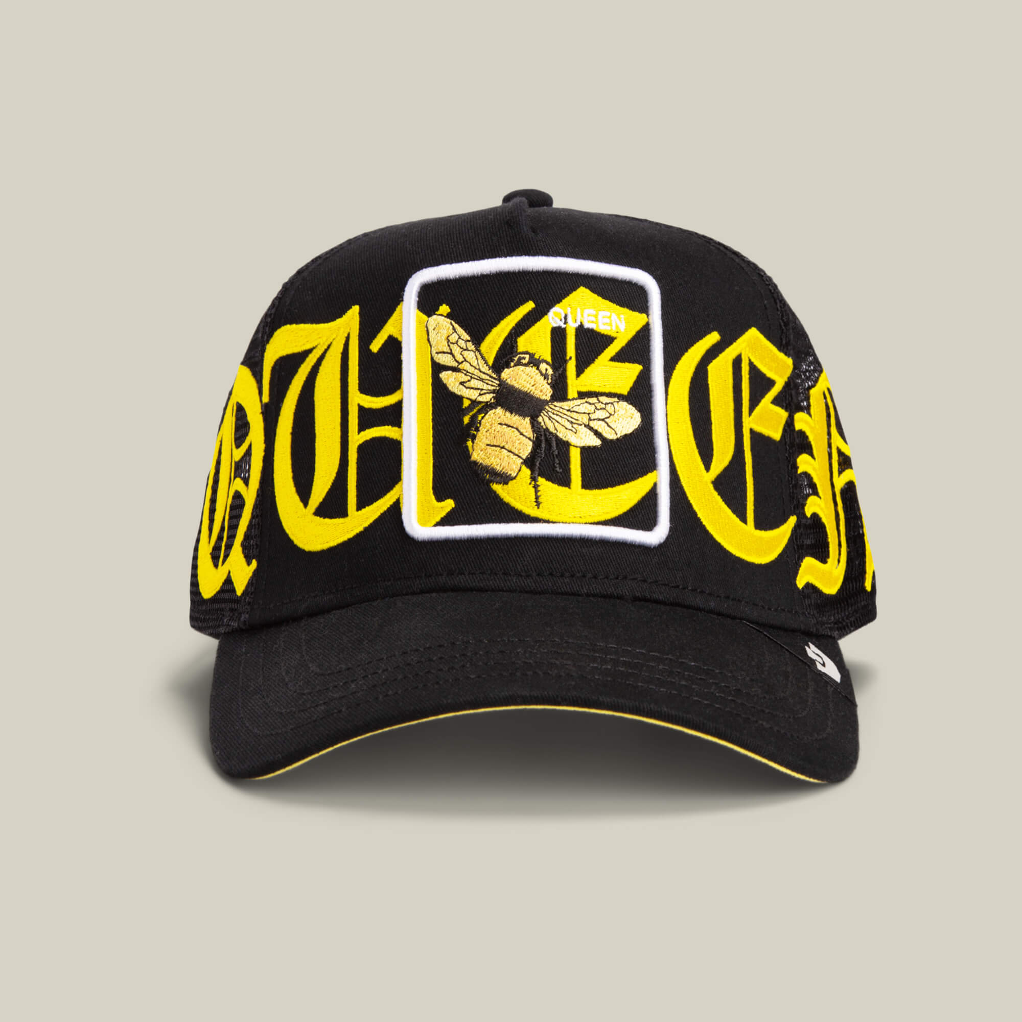 The Goorin Bros. Old English Queen cap in VOID features Old English lettering and a front queen bee patch with "QUEEN" above the detailed bee design.