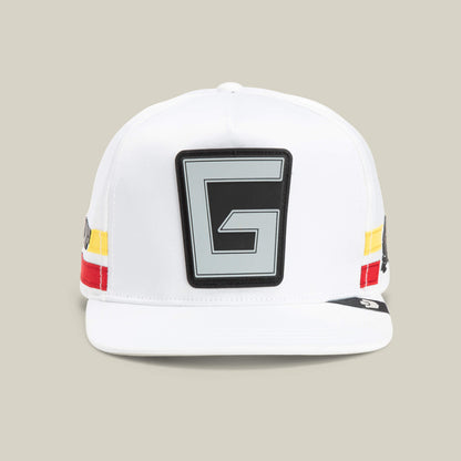 The Goorin Bros. Pole Position - Speedbump hat in DUST features a bold black and gray G patch on the front plus striking red, yellow, and black side stripes for standout style.