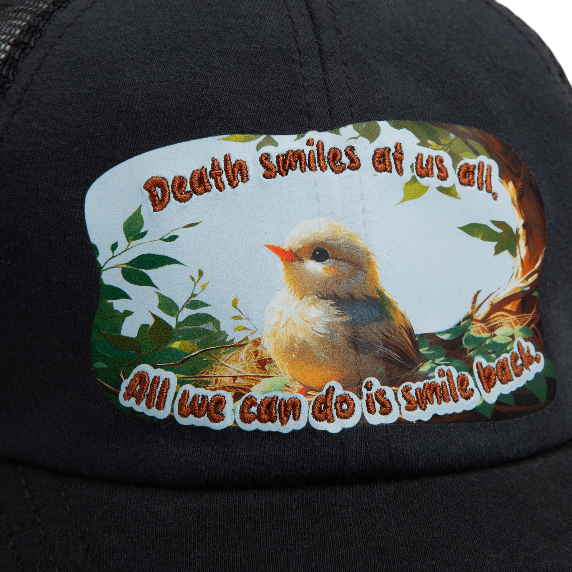 A black Lil Samurai cap from Goorin Bros.' Storybook collection, featuring a fluffy bird in a nest and the text: Death smiles at us all. All we can do is smile back.