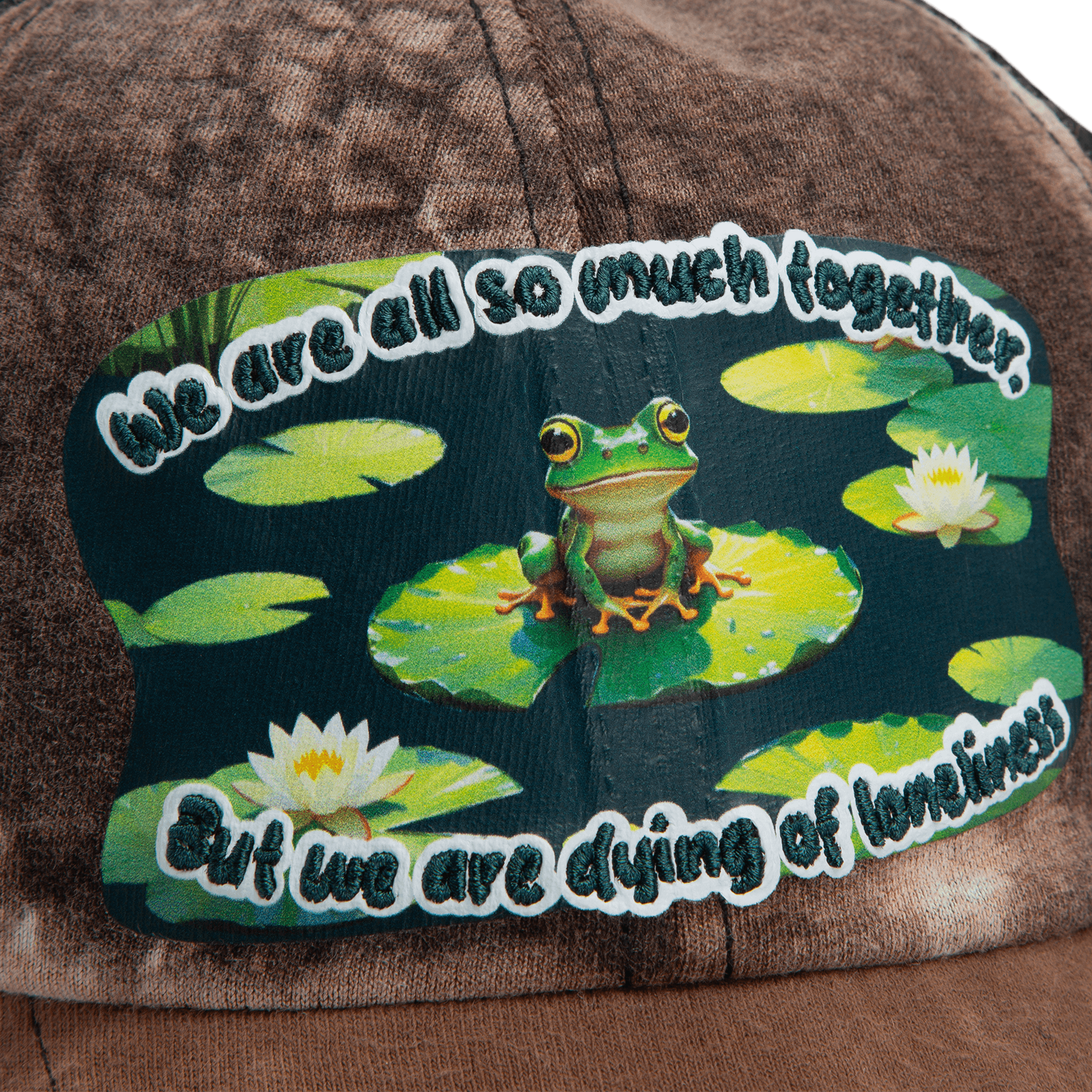 The Goorin Bros. Lil Sohei cap from our Storybook collection features a frog-on-lily pad patch and the phrase, "We are all so much together, but we are dying of loneliness." Discover hats that tell a story.