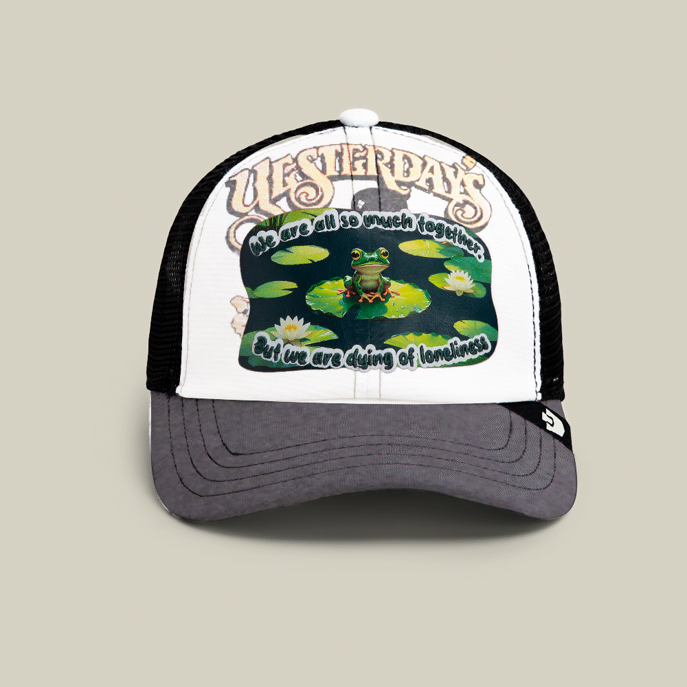Introducing Lil Sohei by Goorin Bros.—a multi-color trucker hat from our Storybook collection, featuring a frog on lily pads and the text YESTERDAYS: “We are all so much together, but we are dying of loneliness.”.