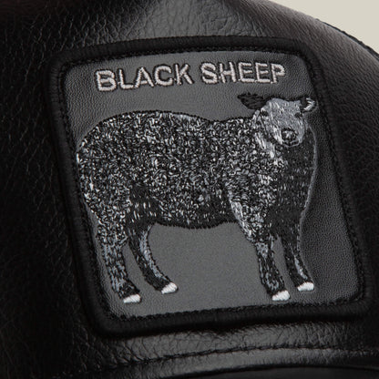 The Goorin Bros. Faux Leather Sheep patch is crafted from black faux leather and features an embroidered black sheep with "BLACK SHEEP" stitched above.