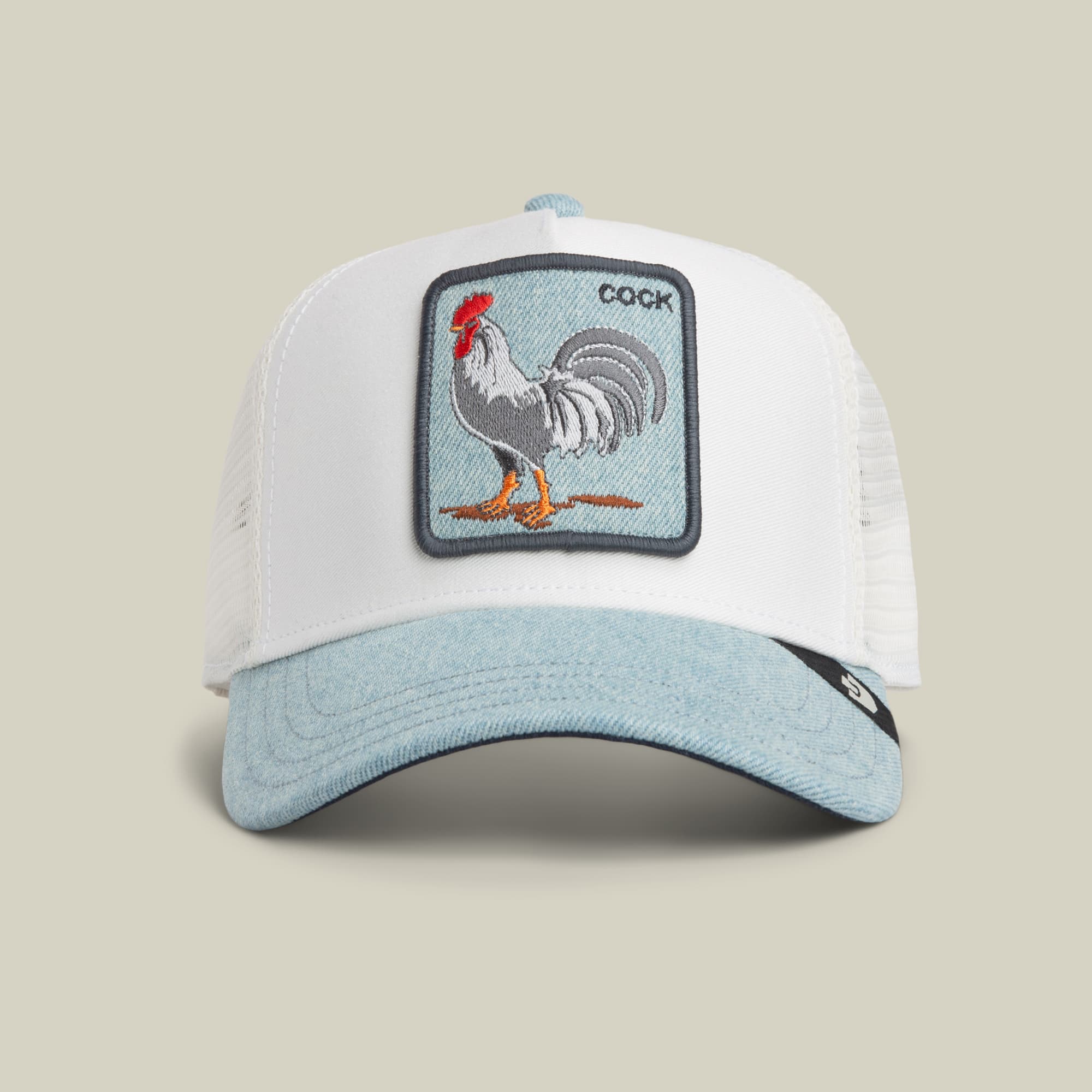 The Goorin Bros. Denim Rooster trucker hat features a white mesh back and light blue denim front with an embroidered rooster patch in red, gray, and orange on the crown, displayed against a neutral background.