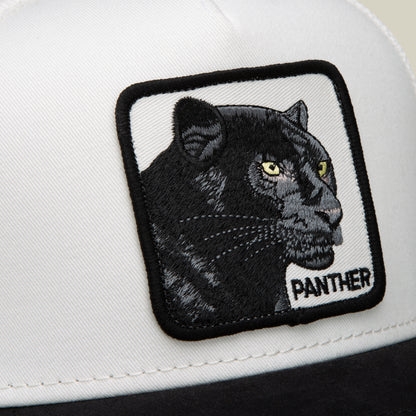 A close-up of the Goorin Bros. Suede Black Panther cap in a black and white colorway, showcasing a bold patch with an embroidered black panther head and “PANTHER” text.