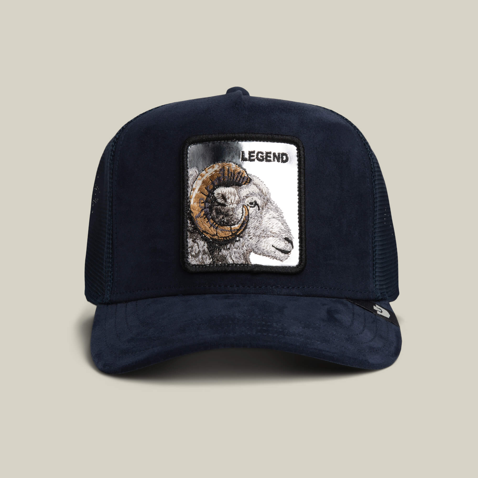 The Goorin Bros. Silver Legend trucker hat in EDGE features a bold ram patch and LEGEND on the front, plus a mesh back for breathability.