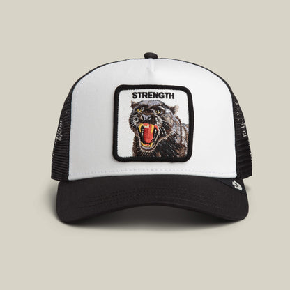 The Strength Panther by Goorin Bros. in DUST / VOID features a bold panther patch with "STRENGTH" embroidered above, making a powerful statement in classic trucker style.