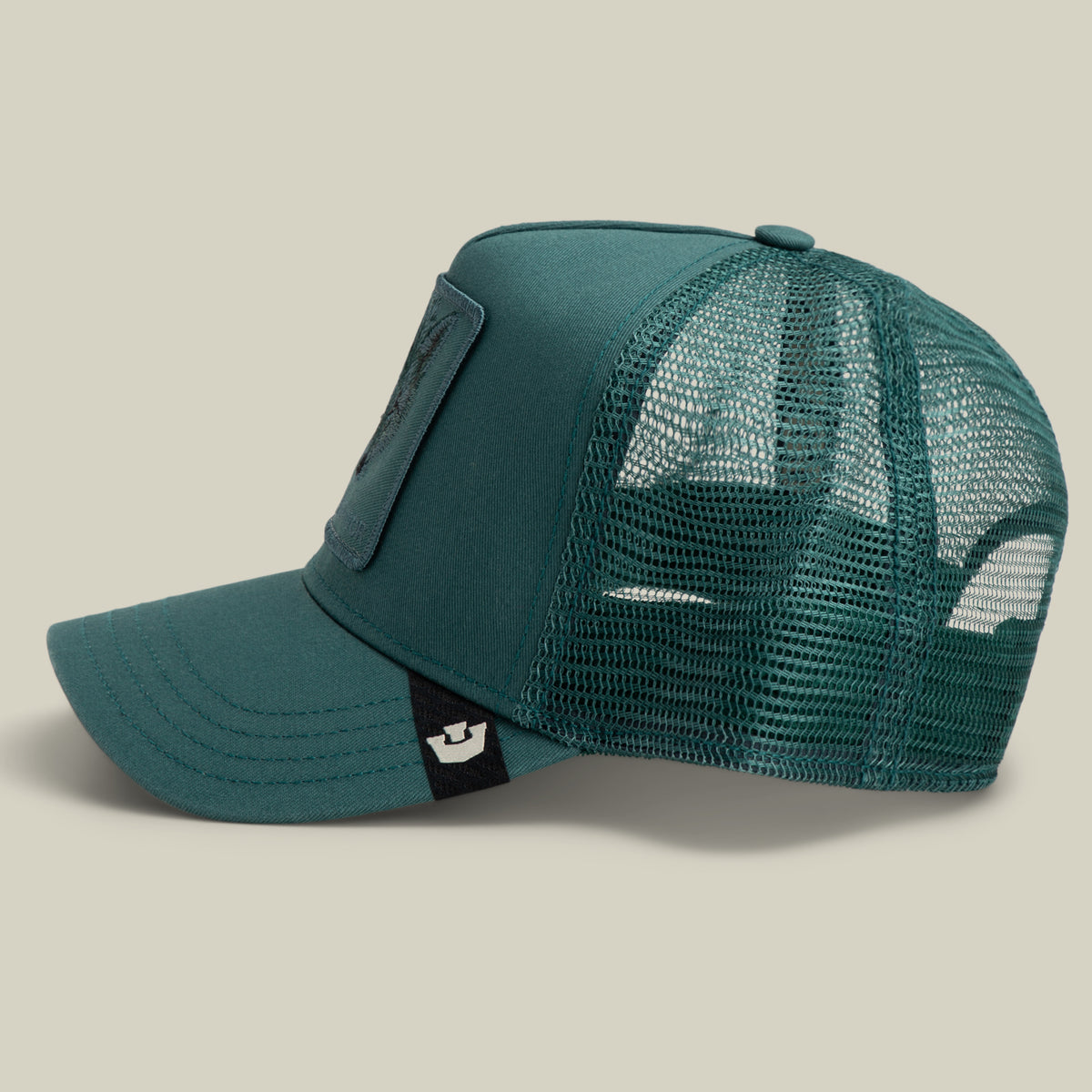 Teal Mirage Survivor trucker hat with a mesh back, a wolf patch on the front, and a survivor logo tag on the brim.