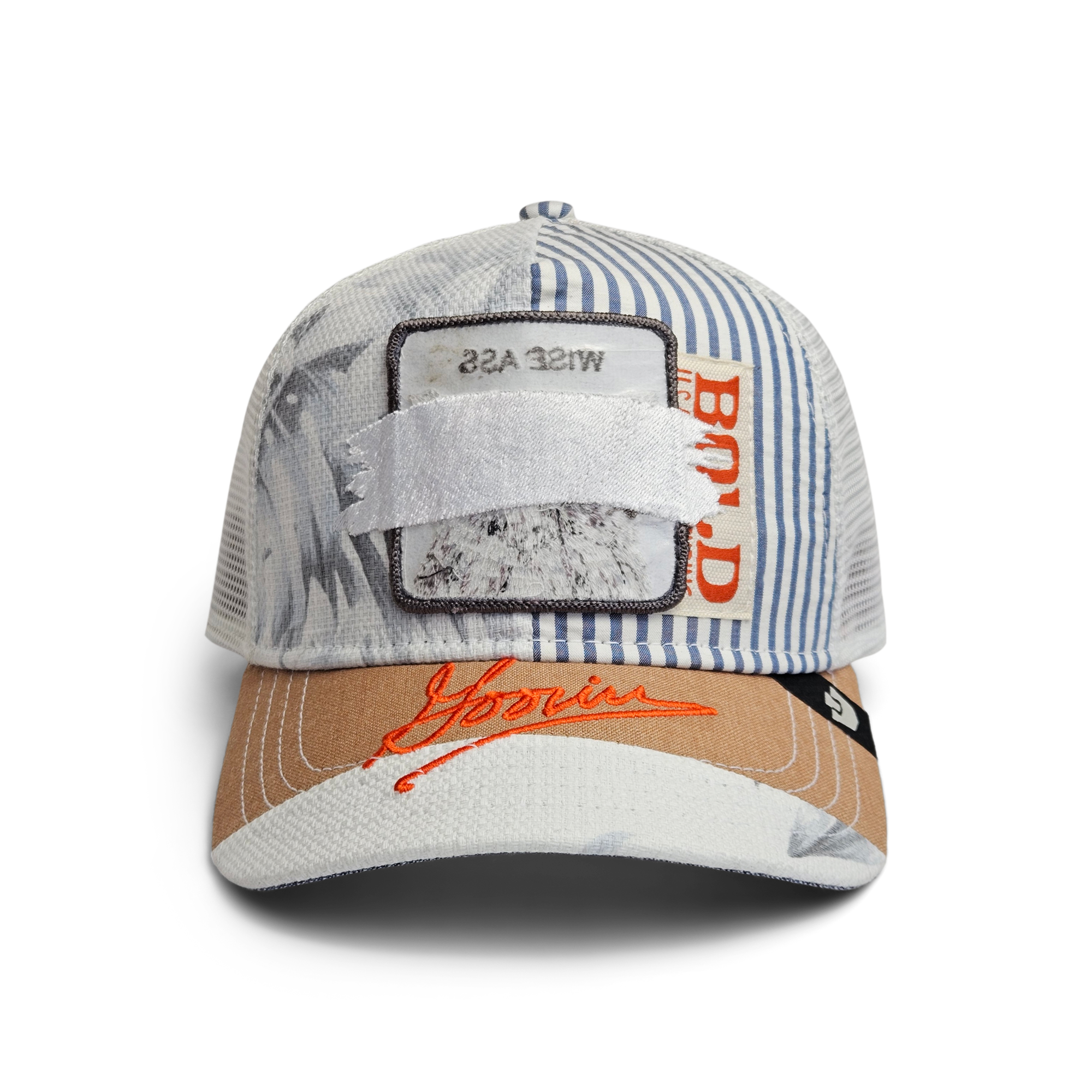 The Goorin Bros. Goorin Rework Trucker in AIR is a limited edition, multicolored trucker hat featuring striped and palm prints, a WISE ASS patch partially covered by white fabric, and red Goorin embroidery on the brim.