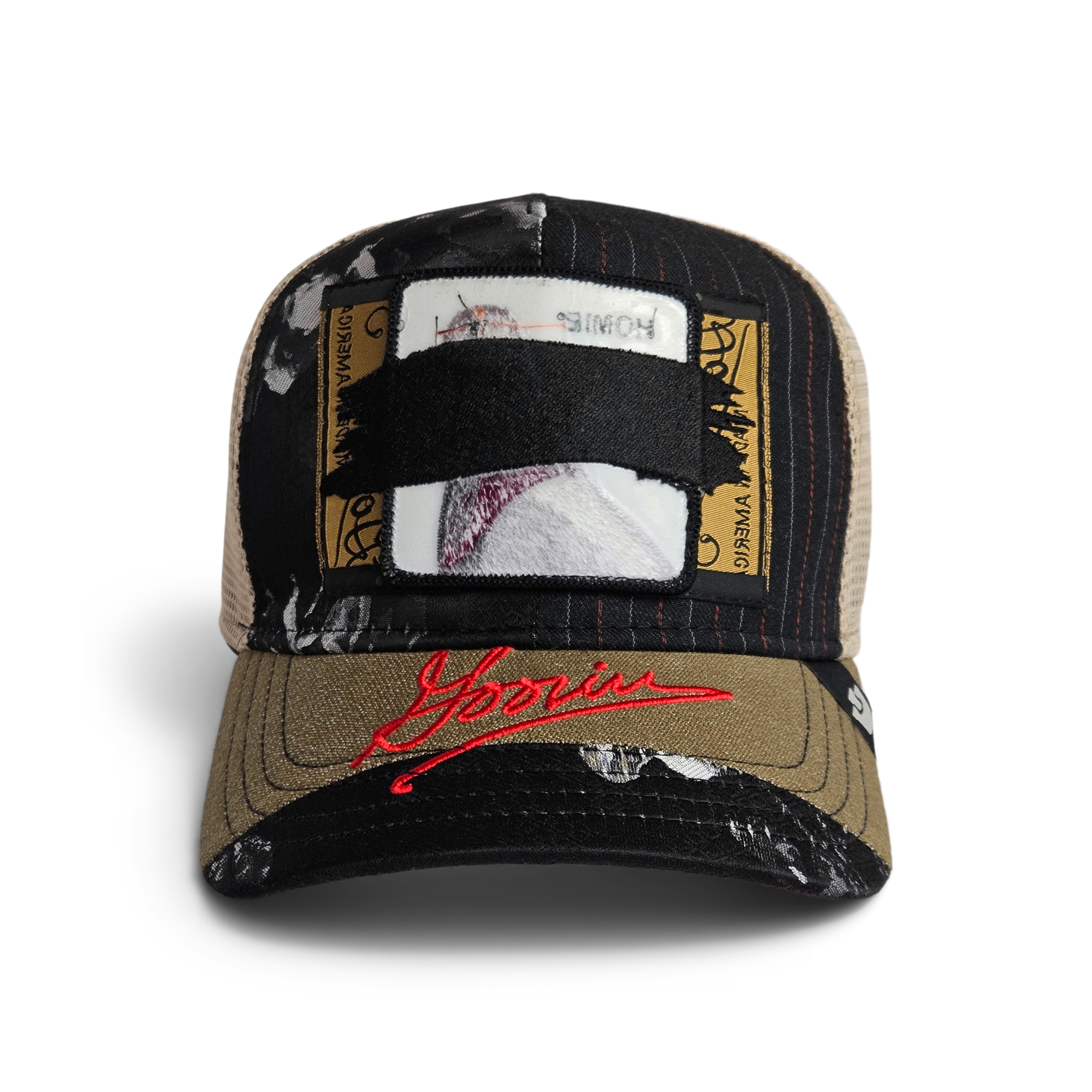 The Goorin Bros. Goorin Rework Trucker in VOID is a limited edition multicolored trucker hat with a patch obscured by a black strap and red script on the brim.