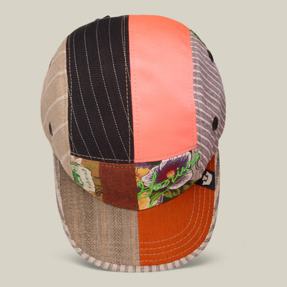The Goorin Bros. Goorin Rework Camper is a limited edition recycled camp cap featuring multicolored fabric panels in stripes, solids, and floral prints, shown from the front.