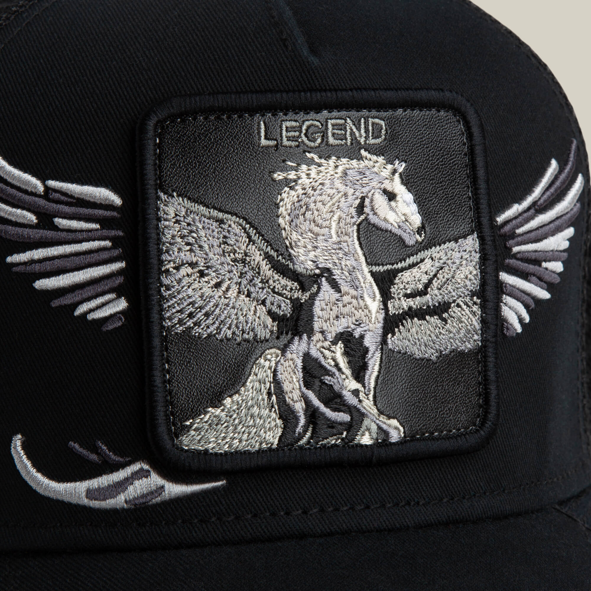 The Goorin Bros. Wings Legend is a black trucker hat featuring an embroidered Pegasus with outstretched wings and the word "LEGEND" above the design.