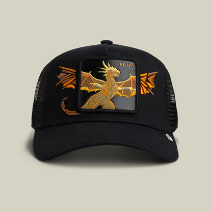 Wings Fury by Goorin Bros is a black mesh trucker hat featuring a gold embroidered dragon patch with orange accents on the front and wings on the sides, displayed against a neutral background.
