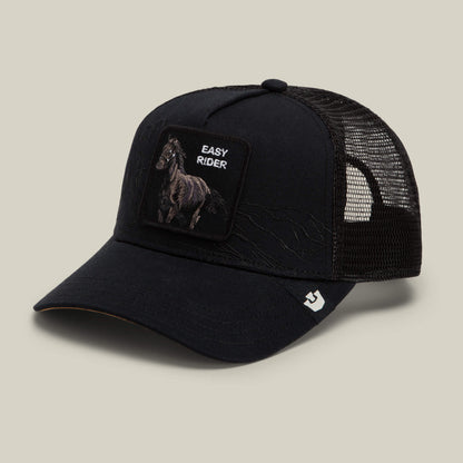 Badlands Stallion trucker hat by Goorin Bros., featuring black mesh, a horse patch, and "EASY RIDER" text on the front, shown at an angle against a neutral background.