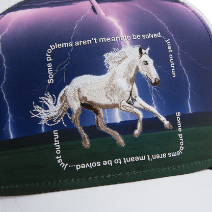 The Goorin Bros. "Through the Storm - Horse" trucker hat features a white horse embroidered against a stormy, lightning-filled sky with text: "Some problems aren’t meant to be solved… just outrun.
