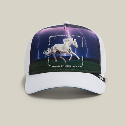 The Goorin Bros. "Through the Storm - Horse" trucker hat features a white mesh design with a galloping horse and lightning sky—an eye-catching accessory for equestrian fans. Color: BLANK.